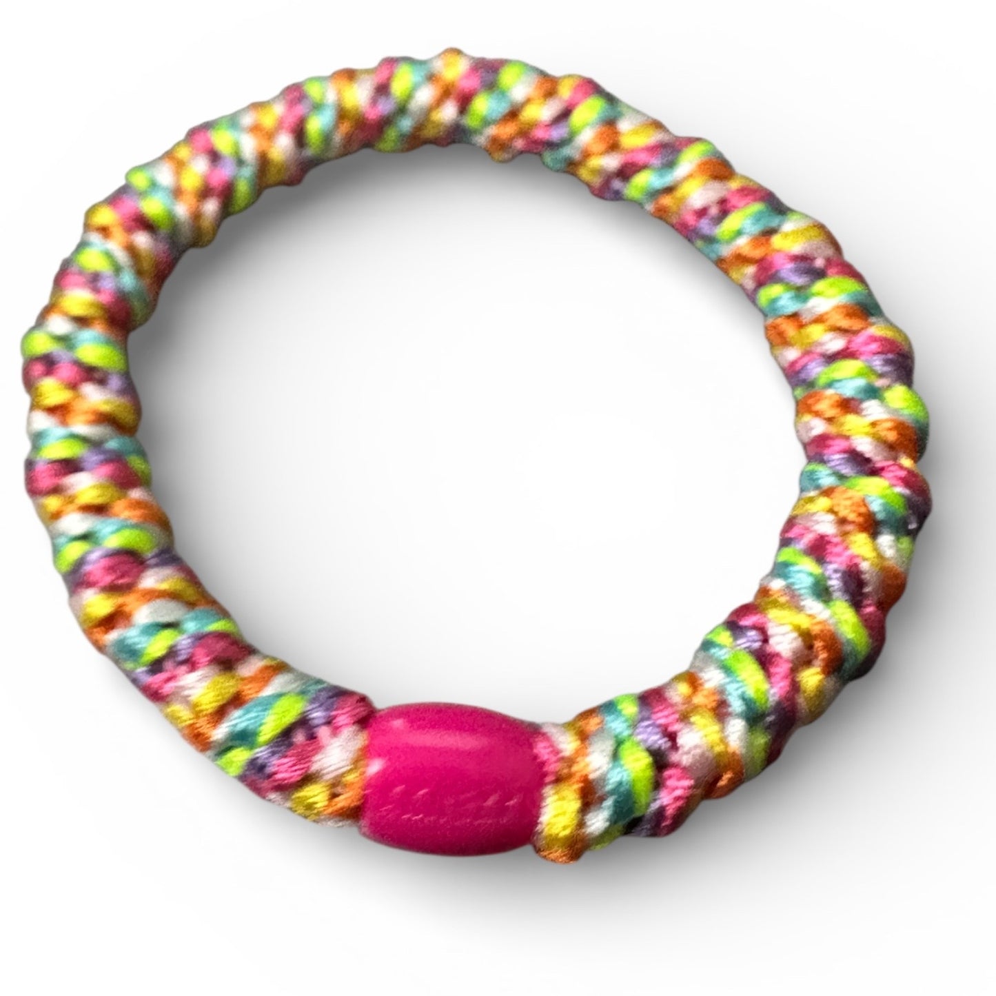 KKNEKKI Rainbow hair tie on white background with branded bead visible