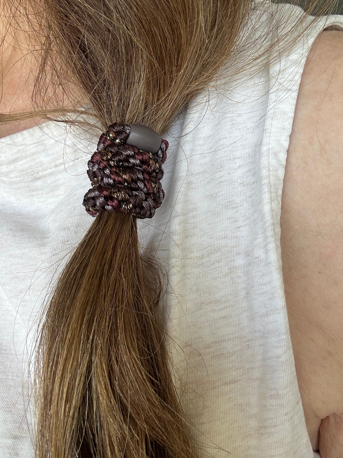 KKNEKKI Brown Coffee Glitter Stripe hair elastic on brown hair.