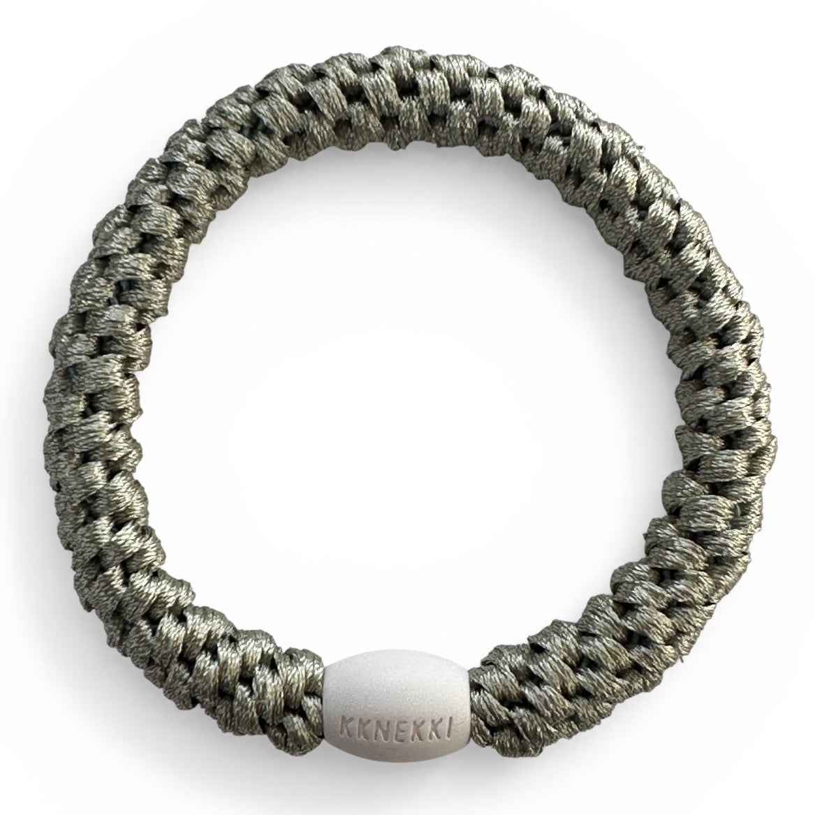 KKNEKKI Dusty Lind Green hair elastic from overhead on white background showing branded bead