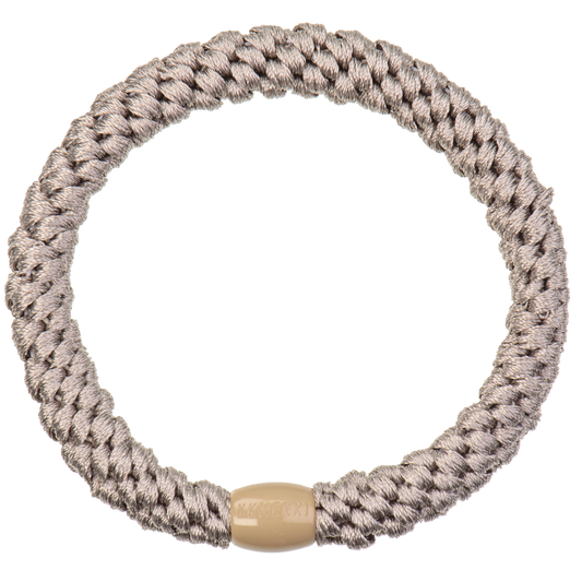 KKNEKKI Light Mole hair elastic on white background with visible branded bead