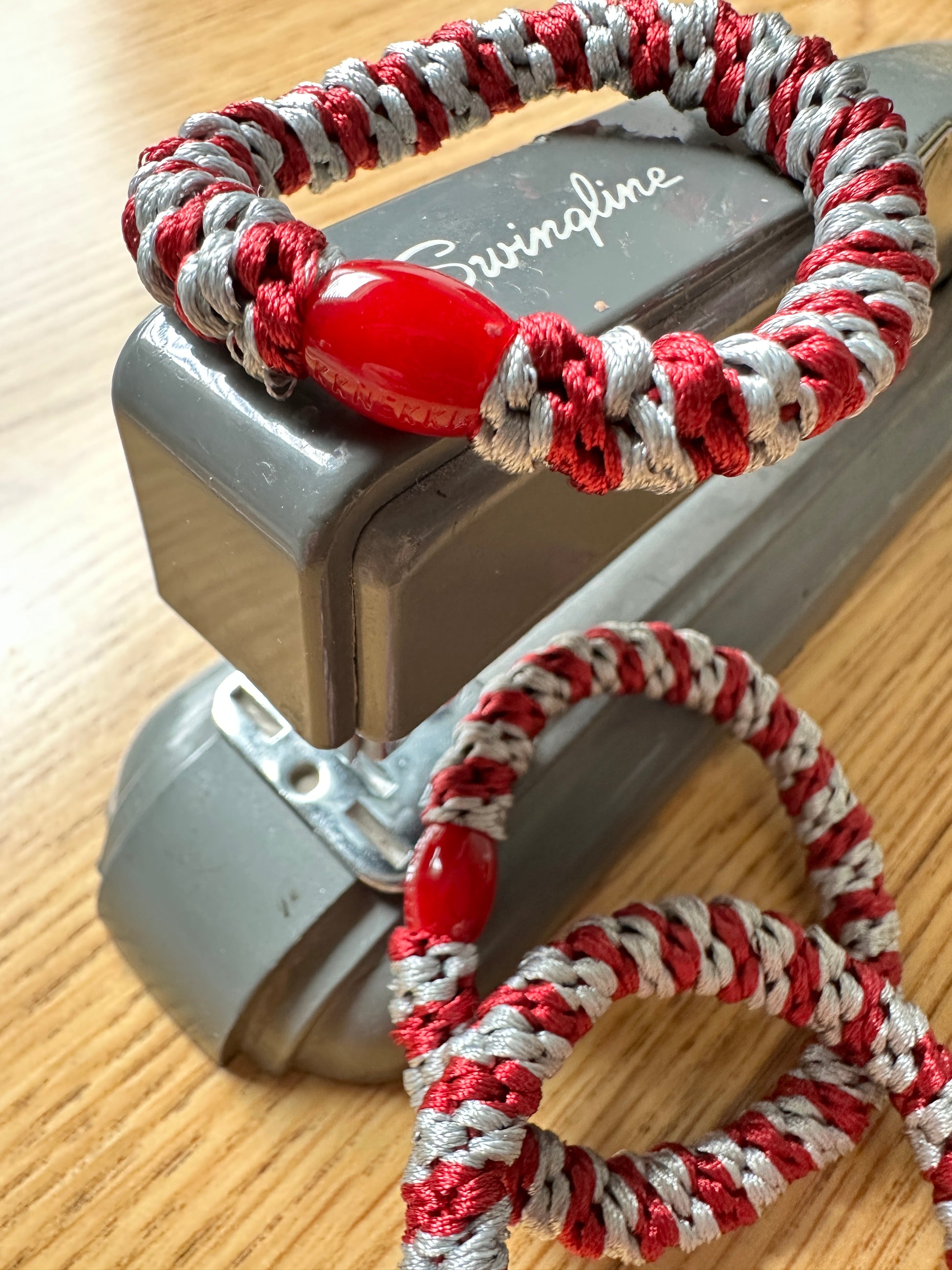 KKNEKKI Maroon-Grey hair tie on Swingline stapler