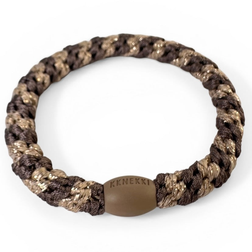KKNEKKI Mole-Beige Glitter hair elastic from the side on white background with visible branded bead