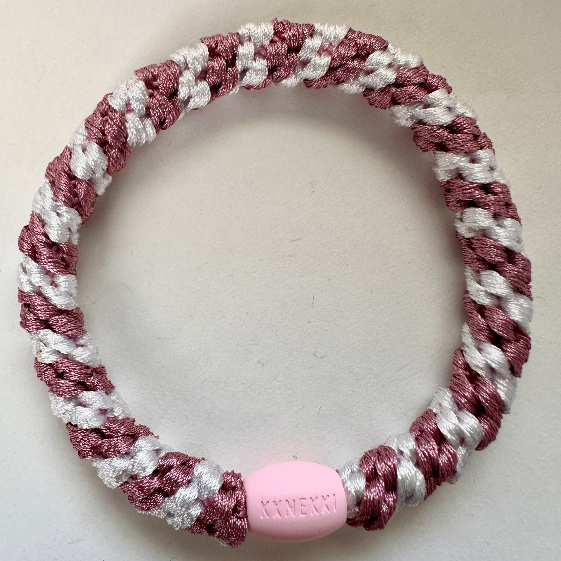 KKNEKKI Old Pink & White Stripe hair elastic laying flat on a white background 