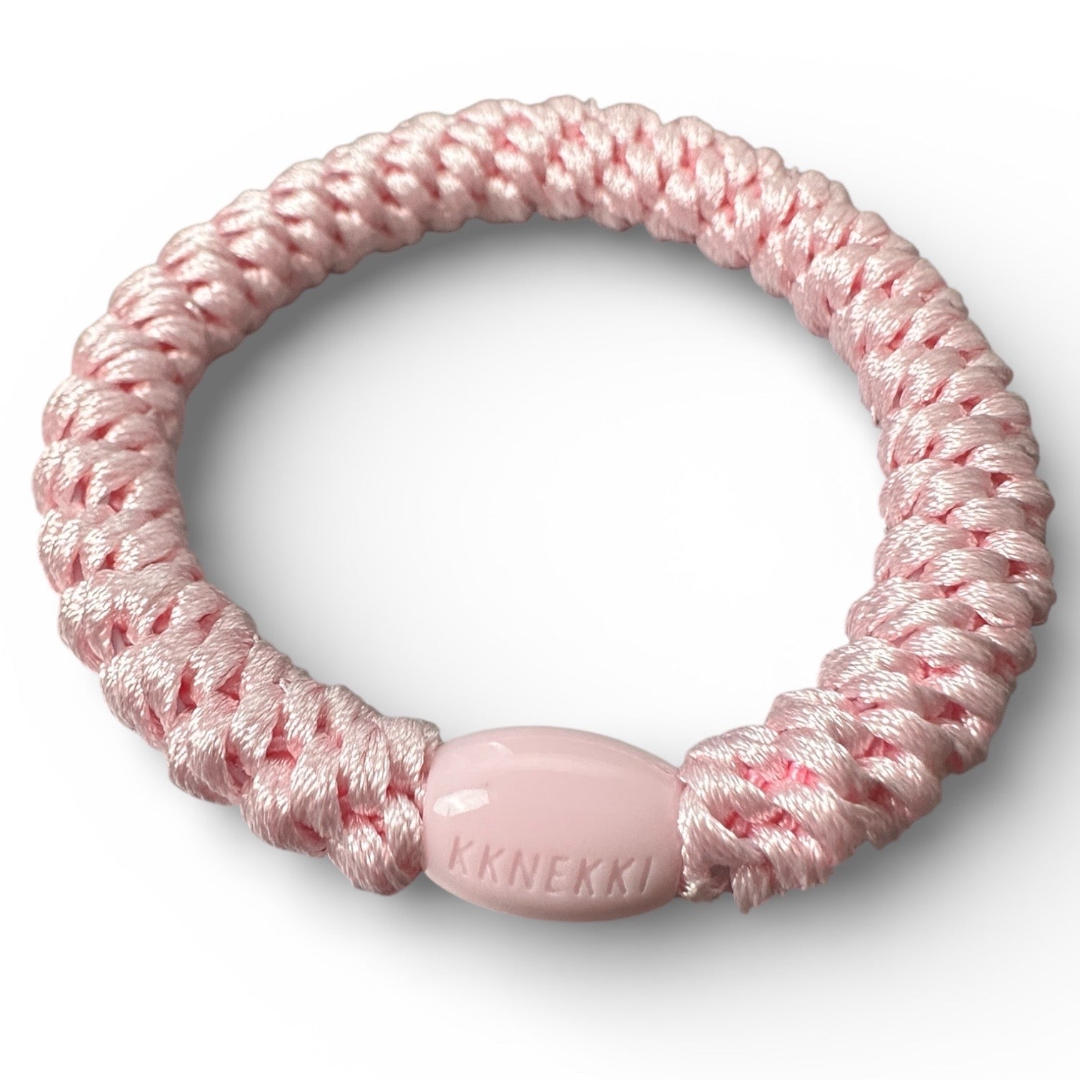 KKNEKKI Pink Light hair tie on white background shows closeup of branded bead