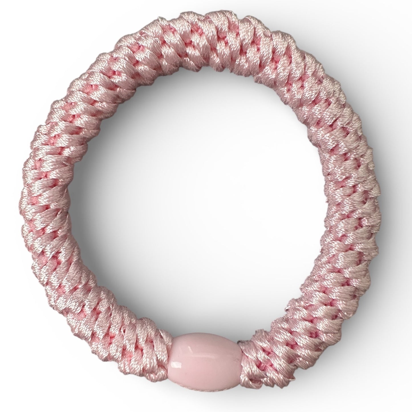 KKNEKKI Pink Light hair tie looking down on another white background different angle