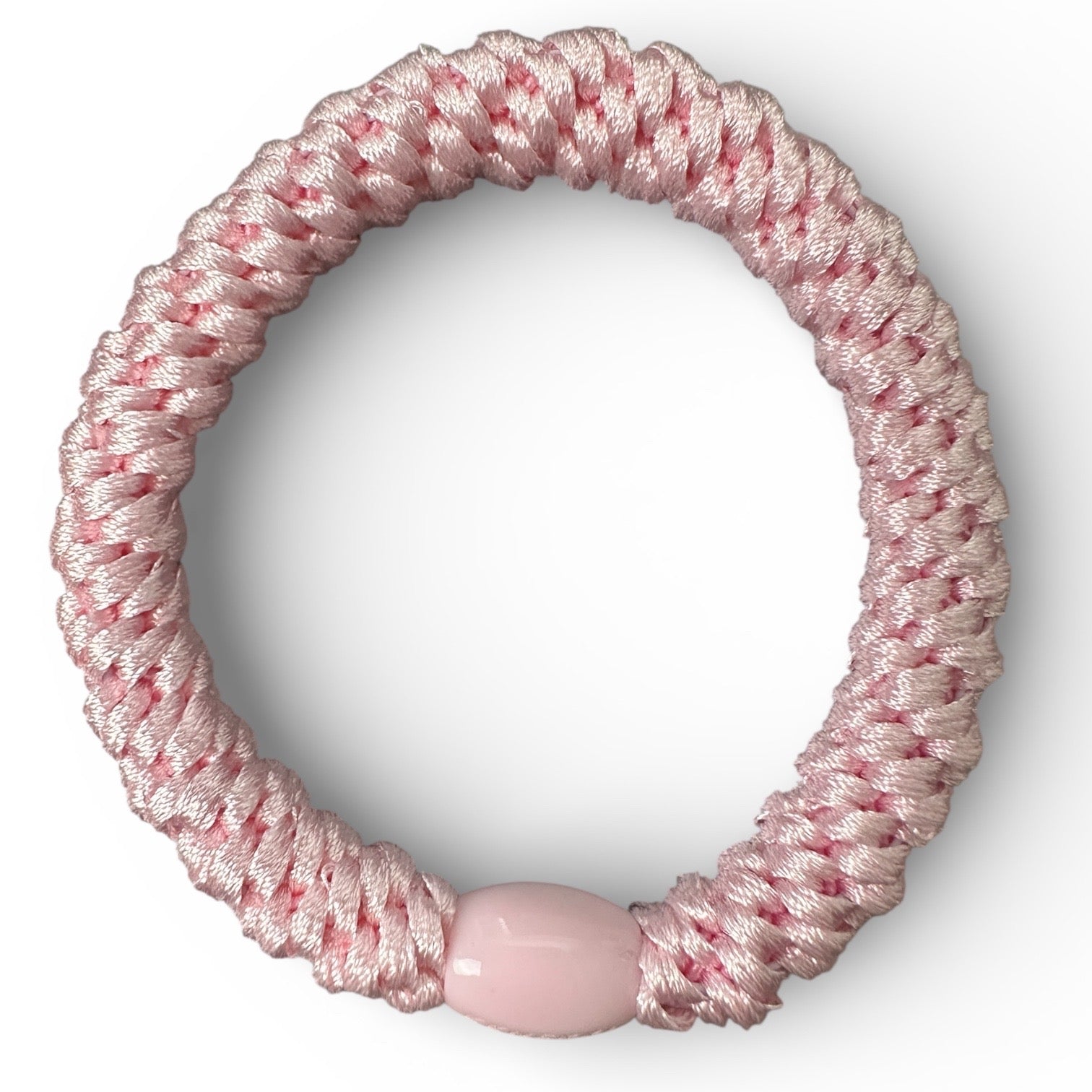 KKNEKKI Pink Light hair tie looking down on another white background different angle