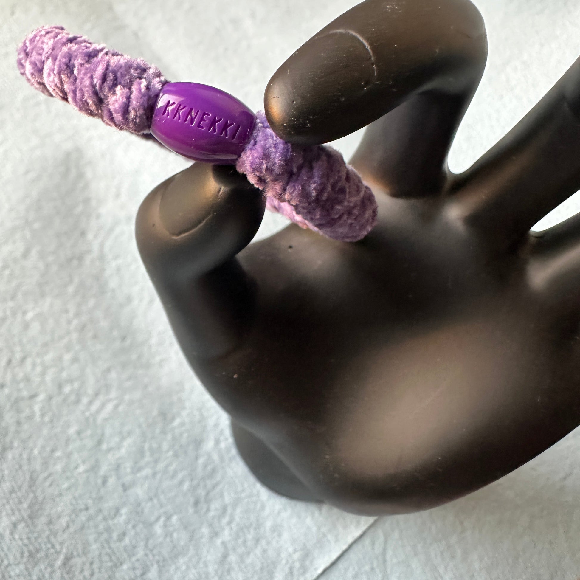KKNEKKI Purple Velvet hair tie elastic in model hand