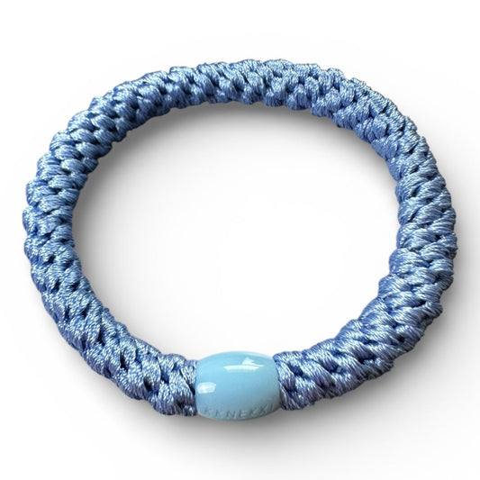 KKNEKKI Robin's Blue hair tie on white background. The branded bead is slightly visible.